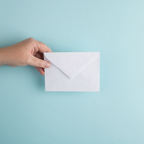 Person holding envelope