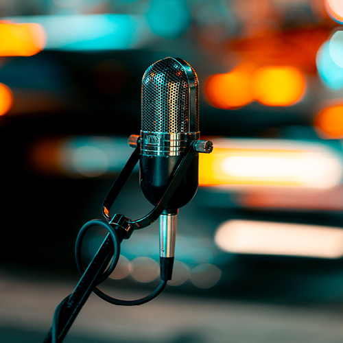 Microphone on a stand with colorful background