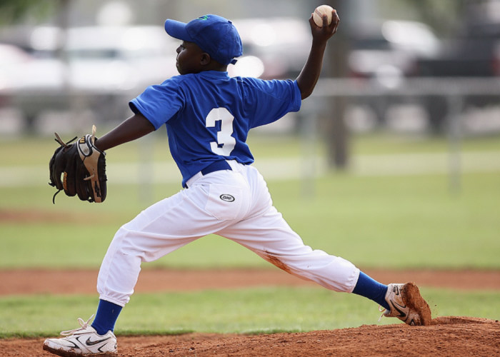 boy-wearing-blue-and-white-3-jersey-about-to-pitch-a-209975